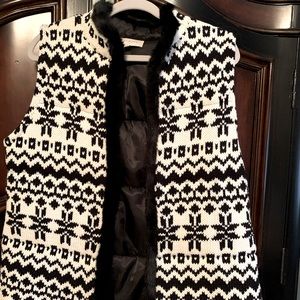 Talbot white and black faux fur vest.